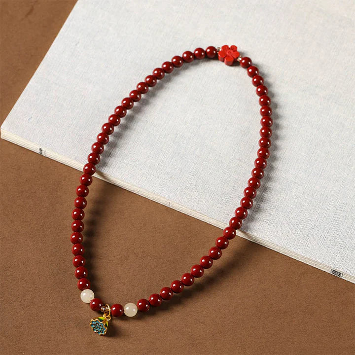 Wrapped in Light – Cinnabar & Lotus Protection Bracelet